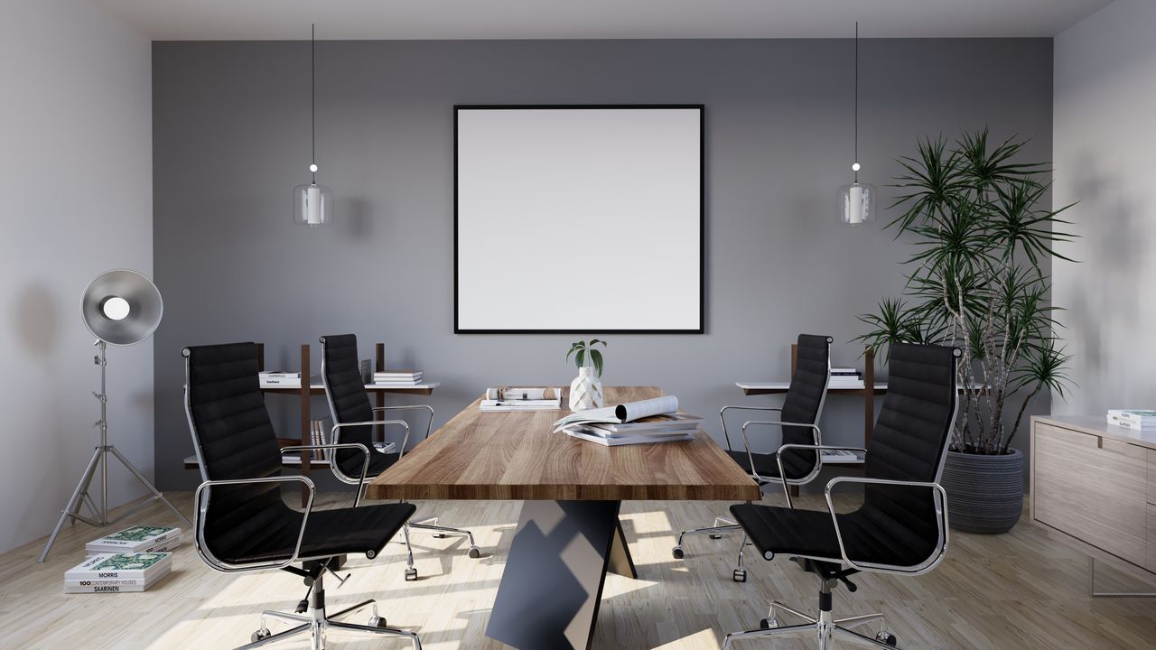 services-01 Sleek and modern conference room with minimalist design featuring stylish furniture and indoor plants.
